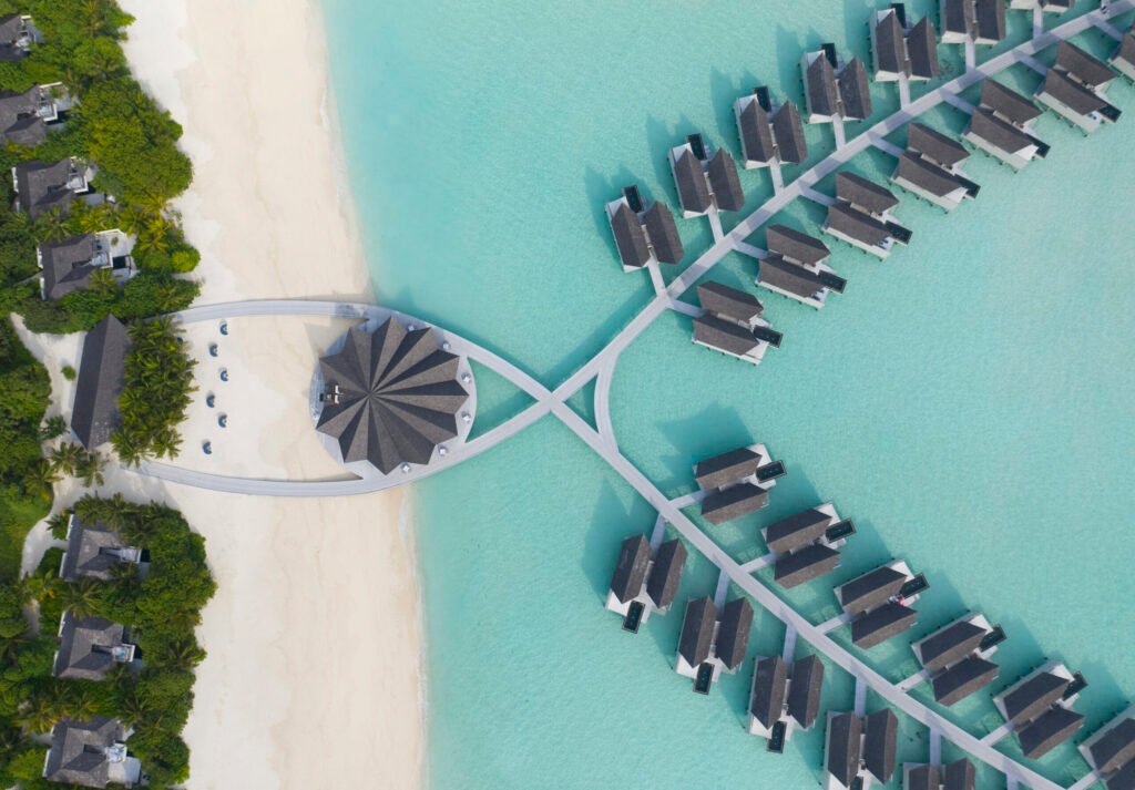 1.-Kuredhivaru-Resort-and-Spa-Overwater-Pool-Villas-aerial-scaled