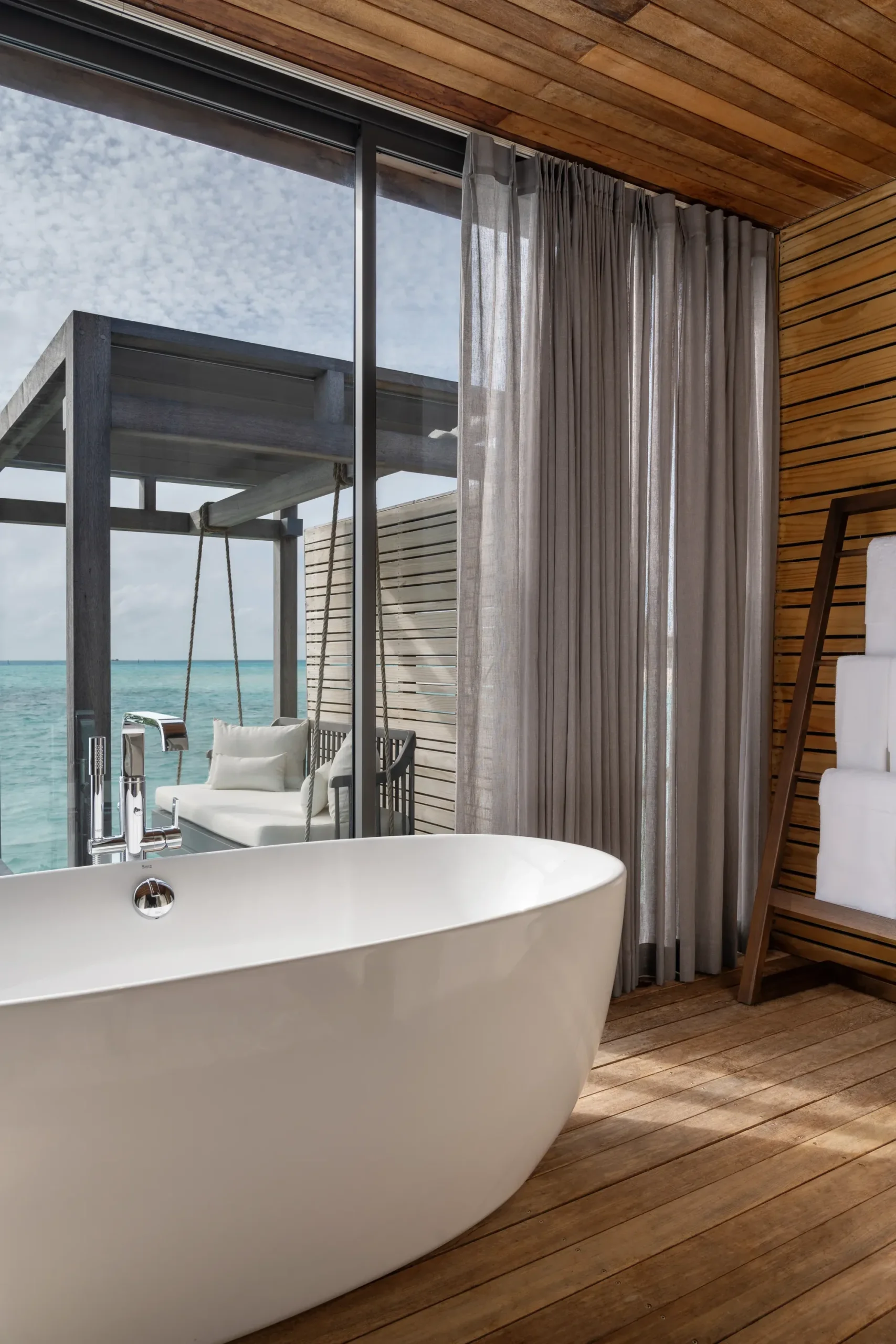 Overwater villa bathroom with ocean view